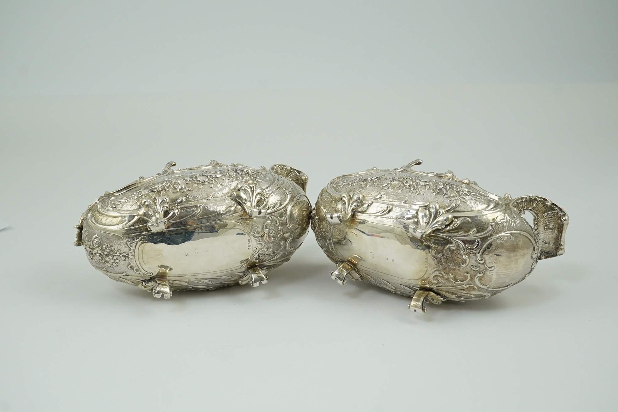 A pair of late 19th century German Hanau ornate embossed silver oval sweetmeat bowls